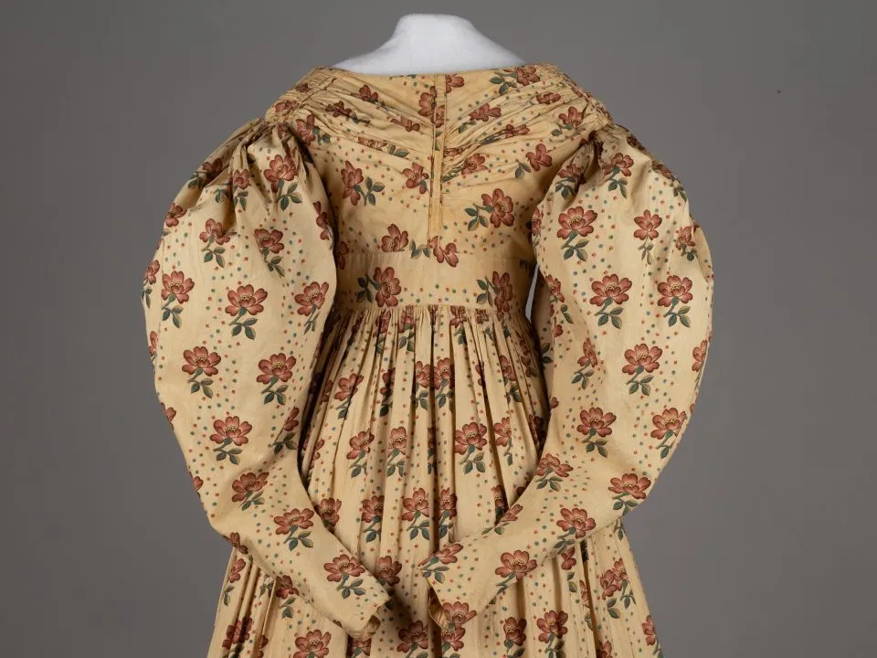 1830s gown with floral print and puffy sleeves