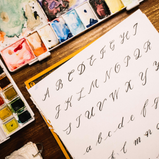 alphabet written in fancy caligraphy