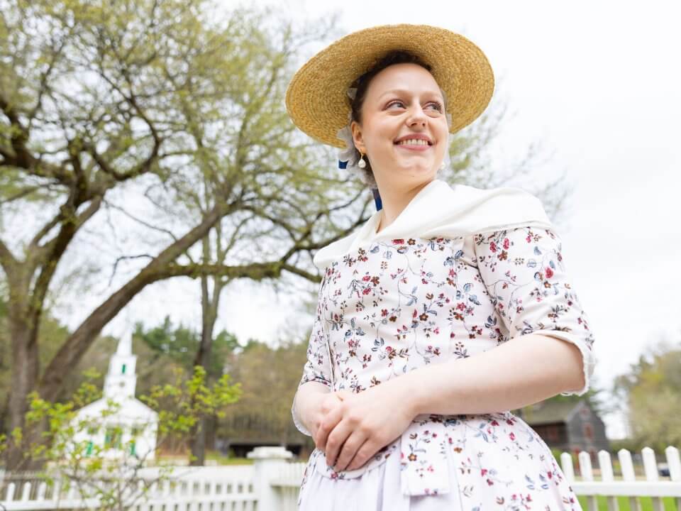 A lady in a floral colonial gown
