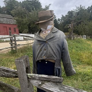 A scarecrow dressed in 1830s attire